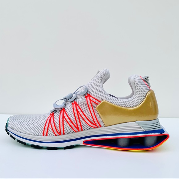 nike shox gravity vast grey metallic gold